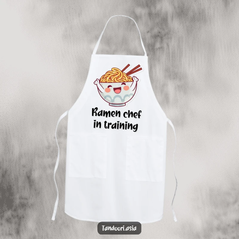 Funny Ramen Apron showing a cute, smiling noodle character waving, perfect for a humorous and practical kitchen accessory.